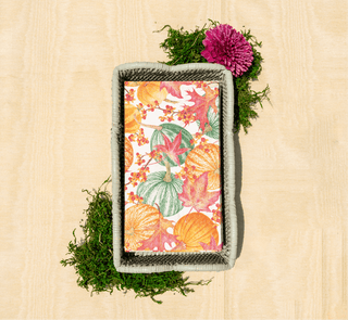Rattan Napkin Holder featuring the napkin pattern "gourds and leaves" showcasing bright autumnal oranges & greens